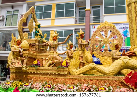 UBON RATCHATHANI, THAILAND - JULY 23: The Candle are carved out of wax, Thai art form of wax(Ubon Candle Festival 2013) on July 23, 2013, UbonRatchathani, Thailand