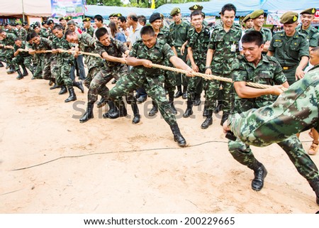UBONRATCHATHANI, THAILAND - JUNE 18 :Unidentified soldiers compete in tug of war during at Social and community development, sustainable recovery happier on June 18, 2012 in Ubonratchathani, Thailand.