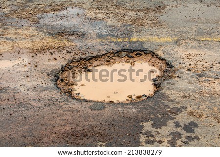 hole in asphalt road