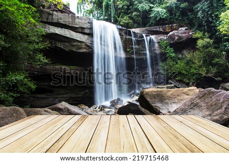 Waterfall with wooden floor platform