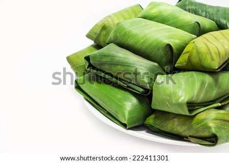 Glutinous rice steamed in banana leaf