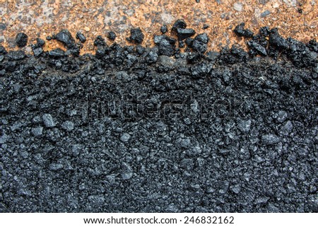 new asphalt road, roadside with rock and soil material