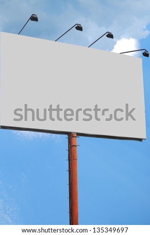 billboard with a total of four lights with blue clouds background