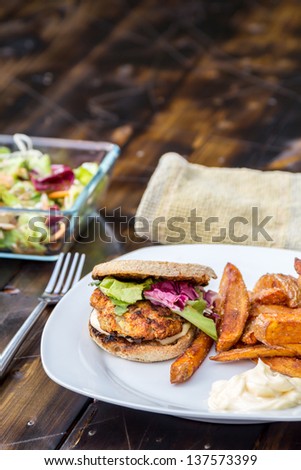 Burger with wholewheat bread, home made fries, salad and mayonnaise