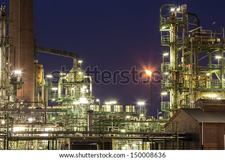 An illuminated chemical plant at night