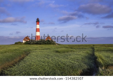 The Lighthouse of Westerhever at the German North Sea Coast during Sunrise