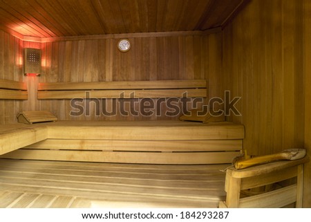 Wooden Sauna Room with water bucket and thermometer