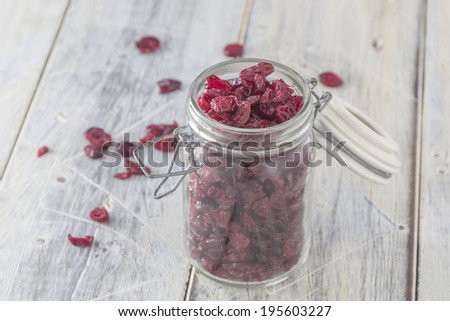 Dried Cranberries in a Jar on a wooden table