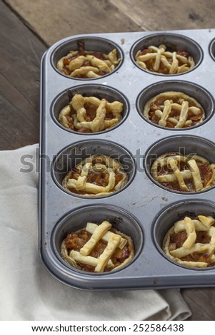 Mini apple pies in a muffin tray