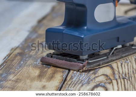 blue grinding machine on rustic wooden surface