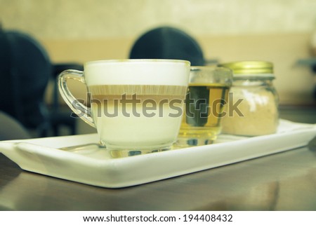 a photo of coffee set with tea and brown sugar,served on table,vintage retro style