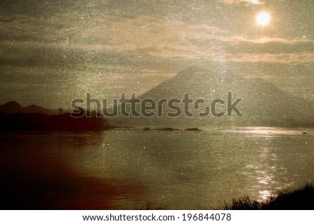 a photo of mountain and river with sunlight
