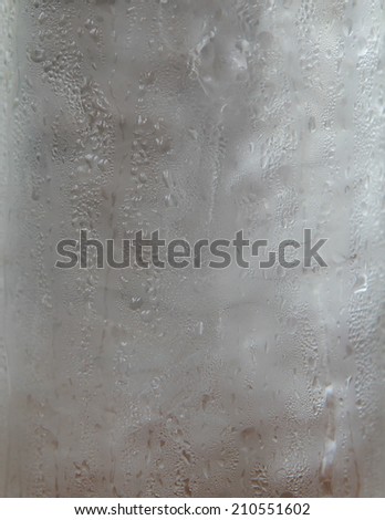 a photo of close up cool water with ice in glass