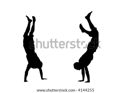 people silhouettes standing. stock photo : Two people standing on their hands - silhouette