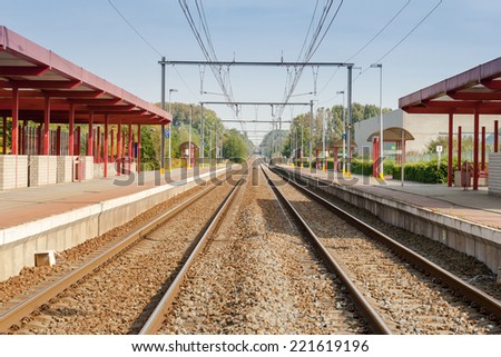 railway station with two tracks and electric power