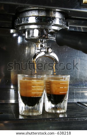 Espresso being drawn out of a professional espresso machine