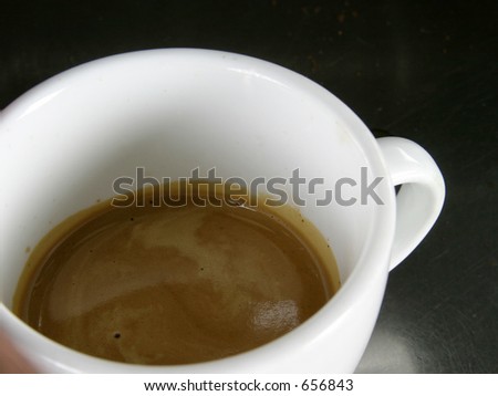 Double espresso in a white cup with nice crema