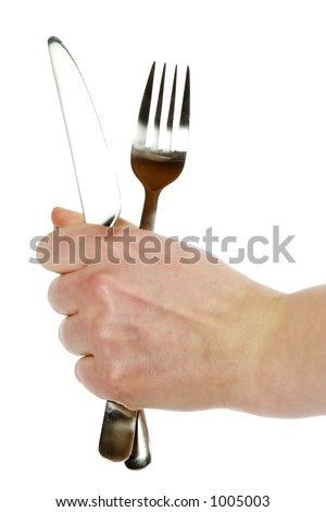 A knife and fork being held by a womans hand.  Isolated on white with clipping path.