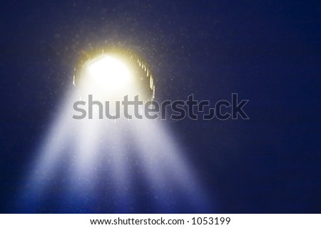 A night sky with a \'ufo\', with beams coming down to earth... spooky
