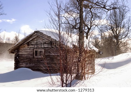 A winter cabin in winter scene
