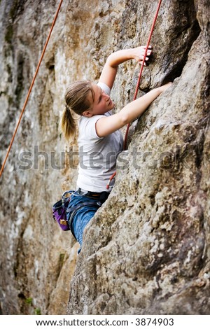 Female climber on a steep crag.