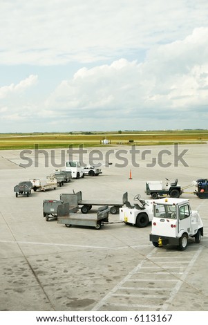 Baggage cars at an airport terminal.