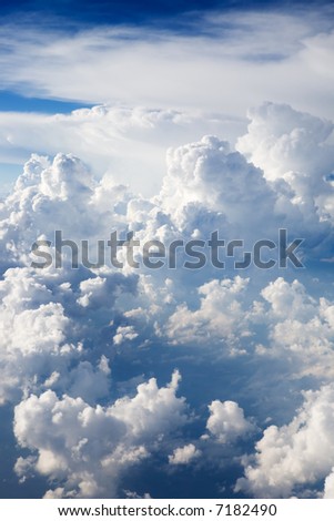A dramatic cloudscape background with cumulus clouds