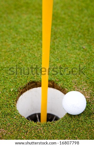 Golf ball very close to going in the hole