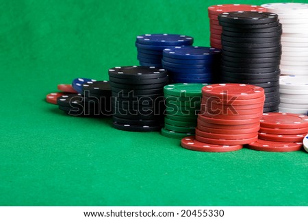 Casino Chips on green felt background