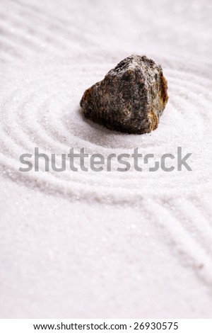 A rock in sand - zen rock garden