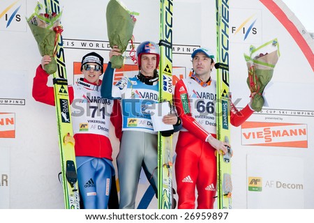 VIKERSUND, NORWAY - MARCH 15: Winners podium at the FIS World Cup Ski Jumping Competition. 1st: Gregor Schlierenzauer (Austria), 2nd: Simon Ammann (Switzerland), 3rd: Dimitry Vassiliev (Russia)