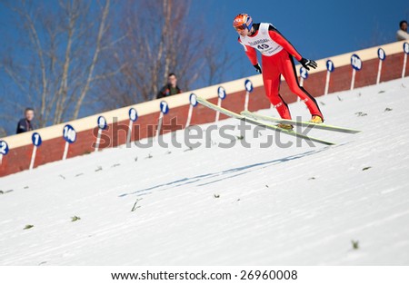 VIKERSUND, NORWAY - MARCH 15: Roar Ljoekelsoey of Norway competes in the FIS World Cup Ski Jumping Competition on March 15, 2009 in Norway.