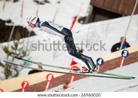 VIKERSUND, NORWAY - MARCH 15: Johan Remen of Norway competes in the FIS World Cup Ski Jumping Competition on March 15, 2009 in Norway.