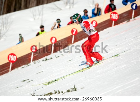 VIKERSUND, NORWAY - MARCH 15: Third place winner, Dimitry Vassiliev of Russia competes in the FIS World Cup Ski Jumping Competition on March 15, 2009 in Norway.