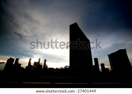 Singpore skyline in dramatic clouds - silhouette
