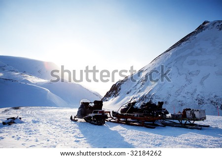 A snowmobile on a beautiful winter mountain landscape