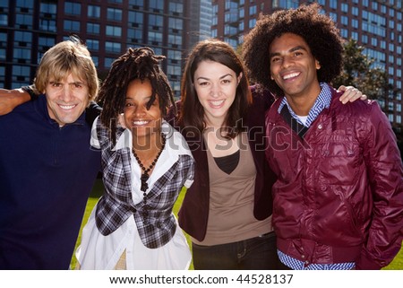 A group of people in front of an apartment building taken into the sun with solar flare