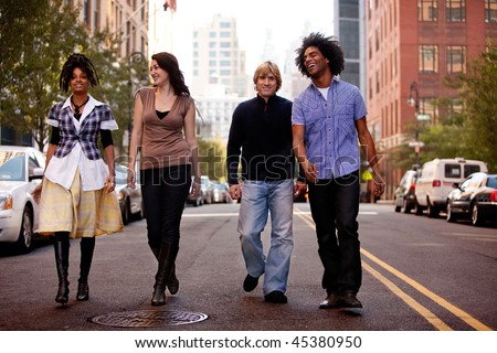 people walking on the street. young people walking down