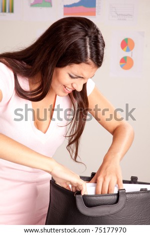 A stress forgetful business woman looking in her briefcase