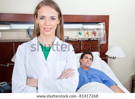Confident female doctor with patient in hospital