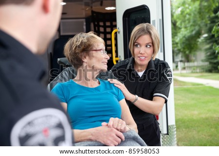 Lifestyle shot of an ambulance worker asking a patient a question