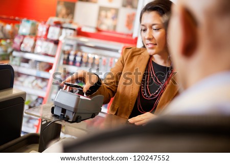 Customer paying for purchase with mobile phone