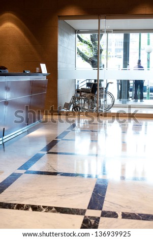 An hospital entry with wheel chair and reception