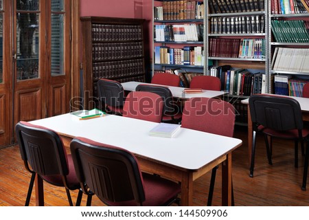 Interior of empty library with bookshelves and seating arrangement