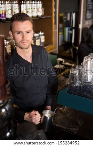 Portrait of young barista working at coffeeshop