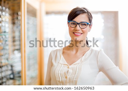 Portrait Of Happy Female Customer Wearing Glasses In Store