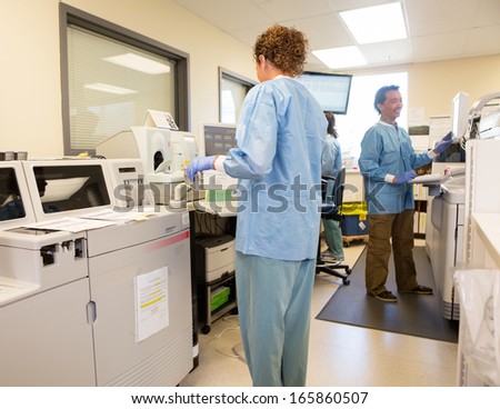 Team of lab technicians working in hospital lab