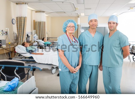 Portrait of multiethnic nurses standing in hospital ward