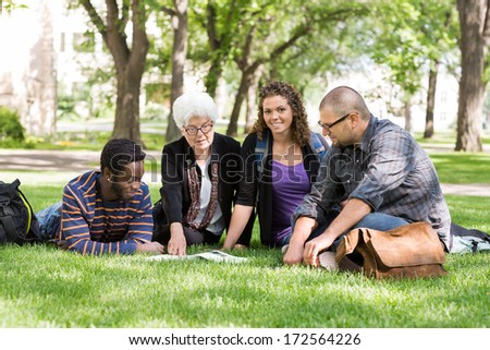 Portrait of group of students with university professor