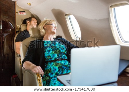 Business people sleeping on private plane
